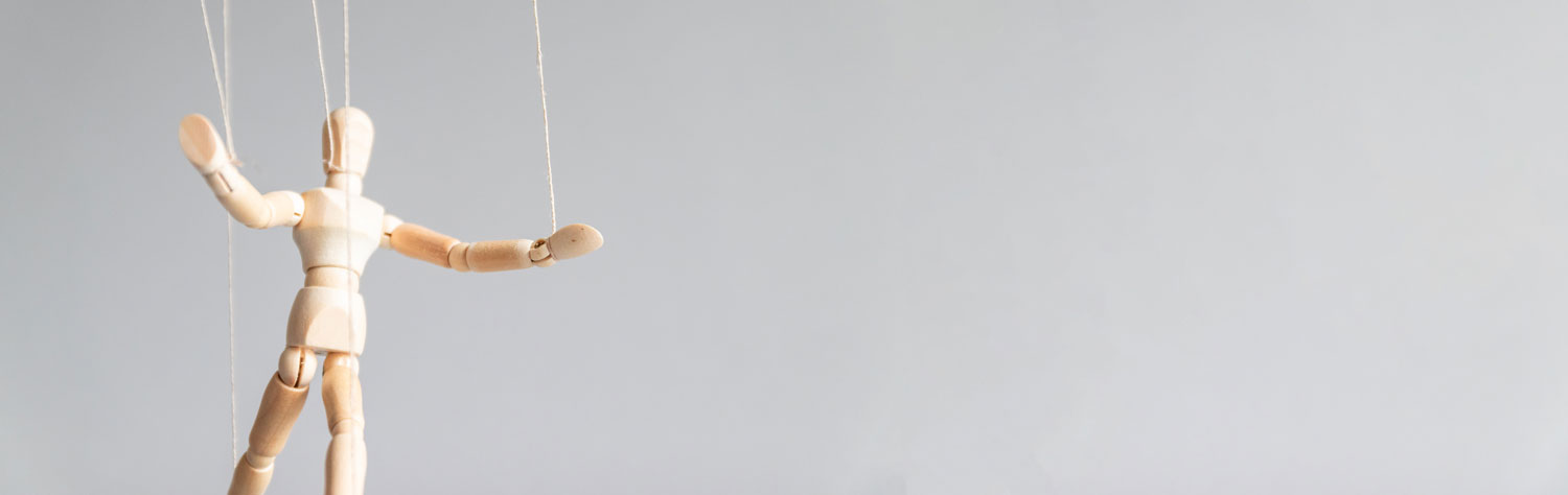 coercive control wooden doll on strings